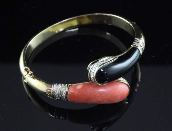 A 14ct gold, coral, black onyx and diamond hinged bangle,